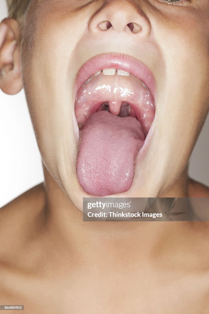 Boy sticking tongue out