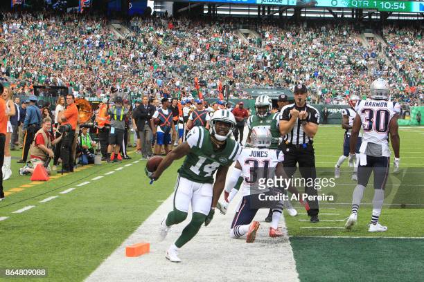 Wide Receiver Jeremy Kerley of the New York Jets makes a difficult catch in action against the New England Patriots during their game at MetLife...
