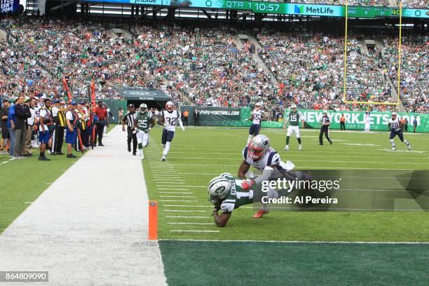 Wide Receiver Jeremy Kerley of the New York Jets makes a difficult catch in action against the New England Patriots during their game at MetLife...