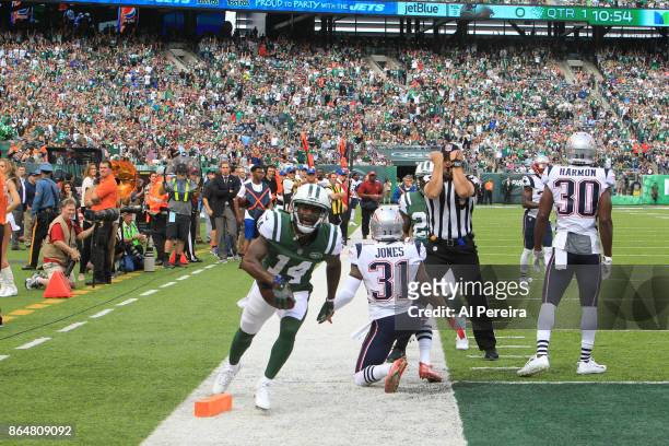 Wide Receiver Jeremy Kerley of the New York Jets makes a difficult catch in action against the New England Patriots during their game at MetLife...