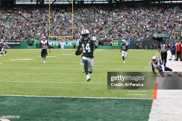 Wide Receiver Jeremy Kerley of the New York Jets scores a Touchdown in action against the New England Patriots during their game at MetLife Stadium...