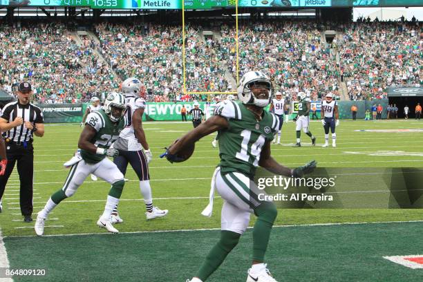 Wide Receiver Jeremy Kerley of the New York Jets makes a difficult catch in action against the New England Patriots during their game at MetLife...