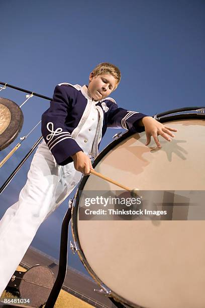 bass drum player in marching band - bass drum stock pictures, royalty-free photos & images