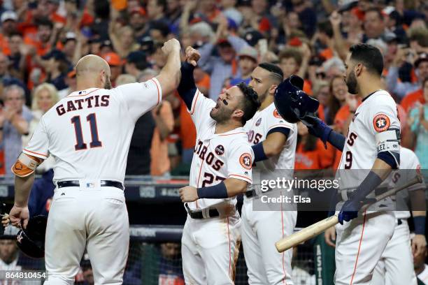 Evan Gattis of the Houston Astros celebrates with Jose Altuve, Carlos Correa and Marwin Gonzalez after hitting a solo home run against CC Sabathia of...