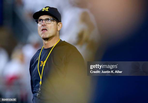 Head coach Jim Harbaugh of the Michigan Wolverines looks on against the Penn State Nittany Lions on October 21, 2017 at Beaver Stadium in State...