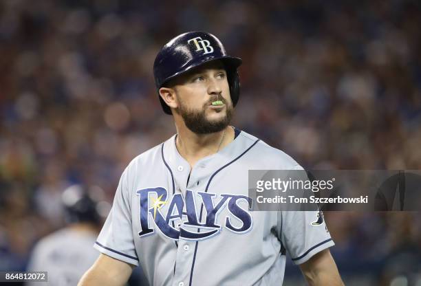Trevor Plouffe of the Tampa Bay Rays reacts as he pops out with the bases loaded in the sixth inning during MLB game action against the Toronto Blue...
