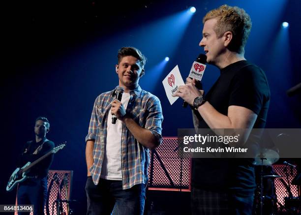 Singer/songwriter Niall Horan and iHeart Radio DJ JoJo Wright speak onstage at the iHeartRadio Album Release Party With Niall Horan at iHeartRadio...