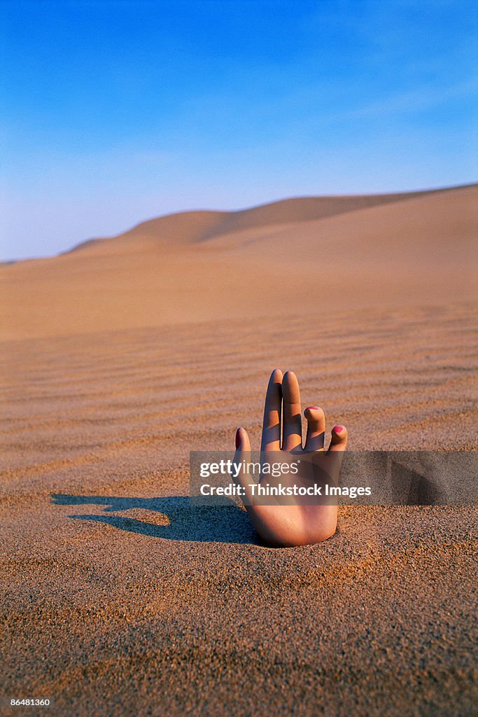 Hand in desert