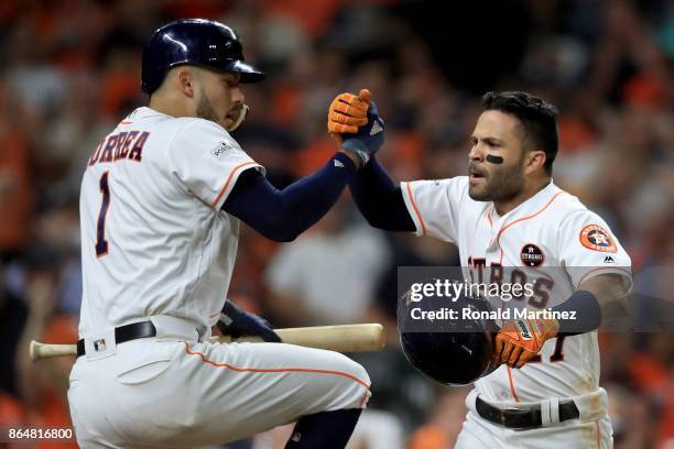 Jose Altuve of the Houston Astros celebrates with Carlos Correa after hitting a solo home run against Tommy Kahnle of the New York Yankees during the...