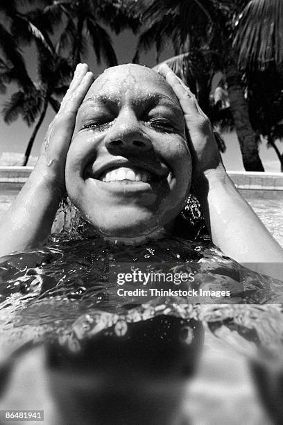 woman in water - women skinny dipping stockfoto's en -beelden