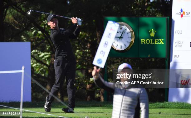 Paul Casey of England tees off on the 2nd hole during the final round of the CJ Cup at Nine Bridges in Jeju Island on October 22, 2017. / AFP PHOTO /...