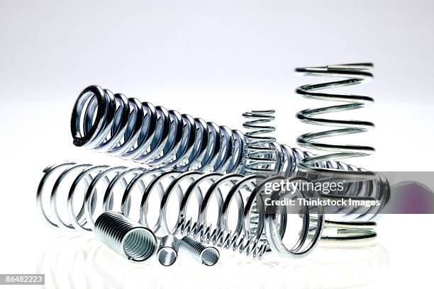 metal springs - coiled spring stock pictures, royalty-free photos & images