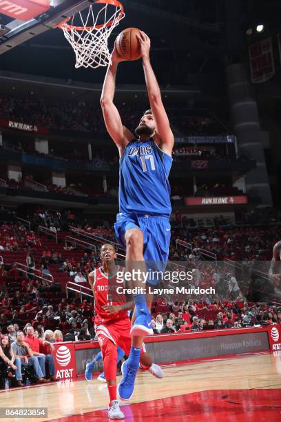 Jeff Withey of the Dallas Mavericks dunks against the Houston Rockets on October 21, 2017 at the Toyota Center in Houston, Texas. NOTE TO USER: User...