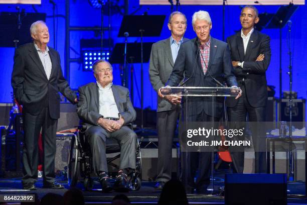 Former US Presidents, Jimmy Carter, George H. W. Bush, George W. Bush, Bill Clinton, and Barack Obama attend the Hurricane Relief concert in College...