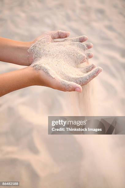 hands holding sand - sifting stock pictures, royalty-free photos & images