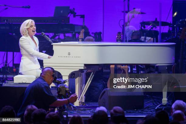 Singer Lady Gaga performs during the Hurricane Relief concert in College Station, Texas, on October 21, 2017. Lady Gaga gave a surprise performance...