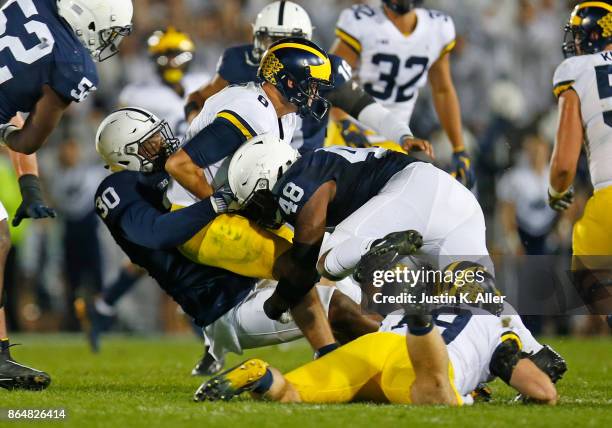 Kevin Givens and Shareef Miller of the Penn State Nittany Lions sack John O'Korn of the Michigan Wolverines in the second half on October 21, 2017 at...