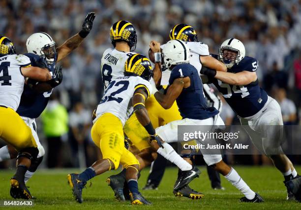 The Penn State Nittany Lions cause John O'Korn of the Michigan Wolverines to fumble in the second half on October 21, 2017 at Beaver Stadium in State...