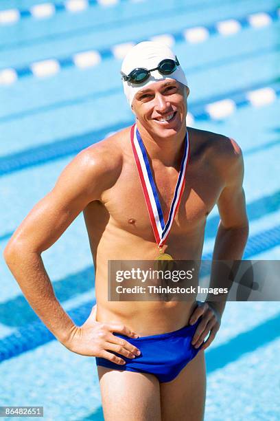 swimmer with medal - golden goggles stock pictures, royalty-free photos & images