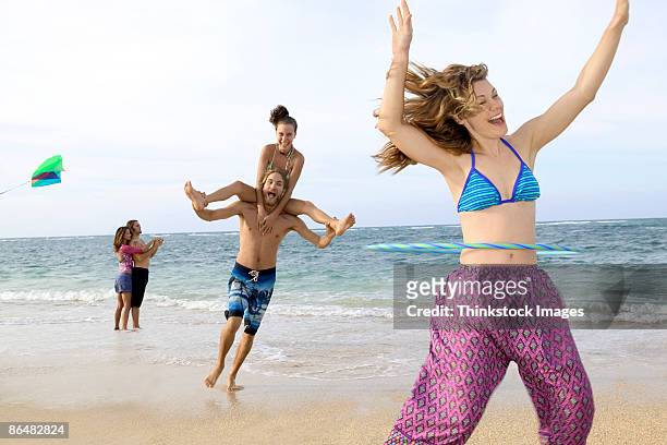 people playing at beach - life si a beach stock pictures, royalty-free photos & images
