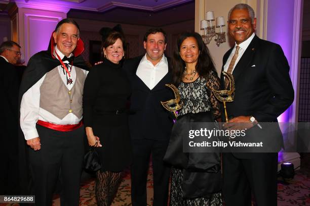 Concordance Academy of Leadership President and CEO Danny Ludeman and his wife Susan Ludeman pose for a photograph with St. Louis County Executive...