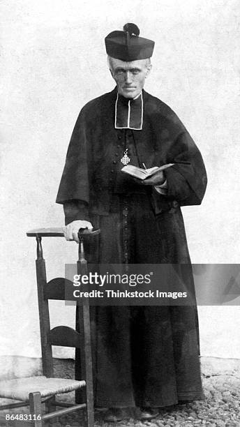 vintage image of priest reading bible - ministero foto e immagini stock