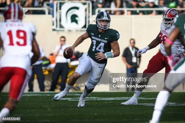 Spartans quarterback Brian Lewerke looks for running room during a Big Ten Conference NCAA football game between Michigan State and Indiana on...