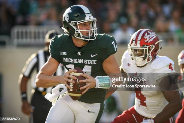 Spartans quarterback Brian Lewerke gets chased out of the pocket by Hoosiers linebacker Chris Covington during a Big Ten Conference NCAA football...
