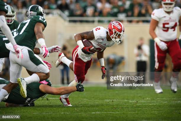 Hoosiers running back Devonte Williams gets tripped up during a Big Ten Conference NCAA football game between Michigan State and Indiana on October...