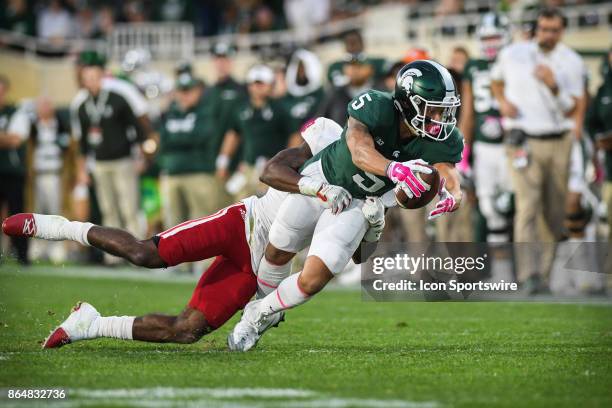 Spartans wide receiver Hunter Rison dives for a first down during a Big Ten Conference NCAA football game between Michigan State and Indiana on...