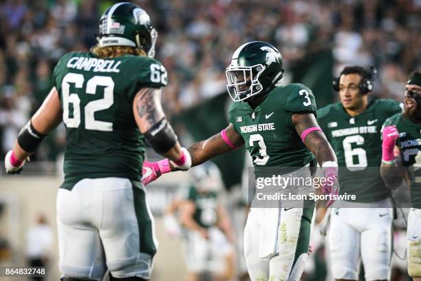 Spartans running back L.J. Scott celebrates a 4th quarter touchdown during a Big Ten Conference NCAA football game between Michigan State and Indiana...
