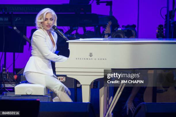 Singer Lady Gaga performs during the Hurricane Relief concert in College Station, Texas, on October 21, 2017. Lady Gaga gave a surprise performance...