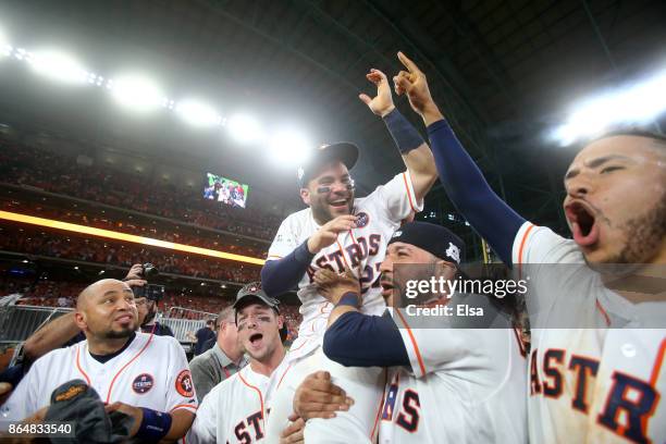 Jose Altuve of the Houston Astros celebrates with Alex Bregman, Marwin Gonzalez and Carlos Correa after defeating the New York Yankees by a score of...