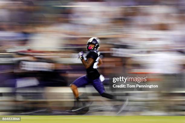 KaVontae Turpin of the TCU Horned Frogs runs a 90 yard punt return for a touchdown against the Kansas Jayhawks in the second half at Amon G. Carter...