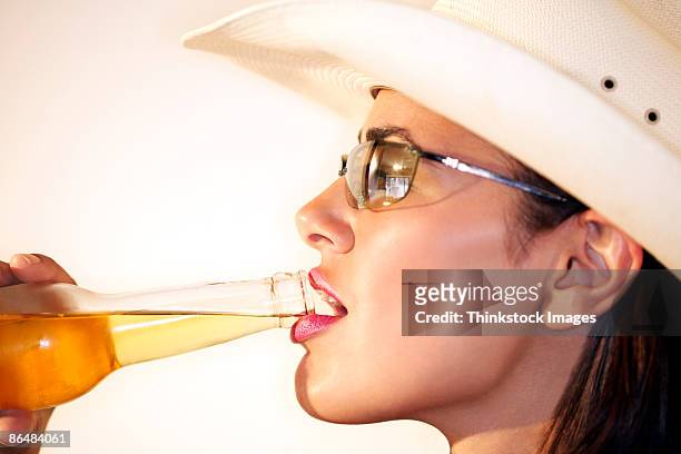 woman drinking - beer bottle mouth stock-fotos und bilder