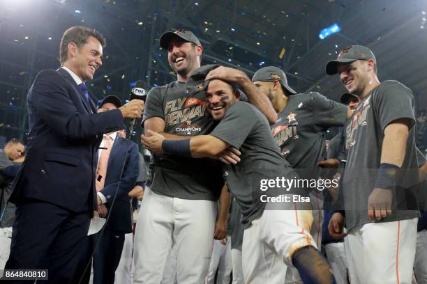 Justin Verlander of the Houston Astros celebrates with Jose Altuve after defeating the New York Yankees by a score of 4-0 to win Game Seven of the...