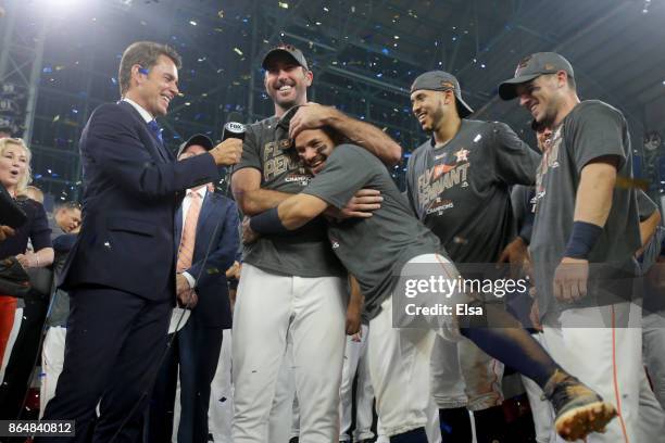 Justin Verlander of the Houston Astros celebrates with Jose Altuve after defeating the New York Yankees by a score of 4-0 to win Game Seven of the...