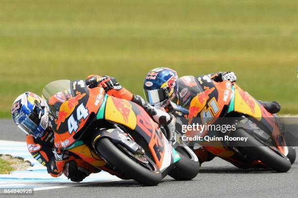Miguel Oliveira of Portugal and the Red Bull KTM AJO leads Brad Binder of South Africa and the Red Bull KTM AJO during the Moto2 race during the 2017...