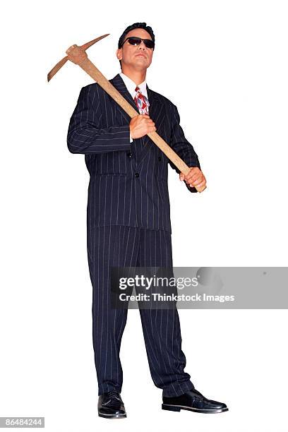 businessman in pinstripe suit with pick-axe - pickaxe stock pictures, royalty-free photos & images