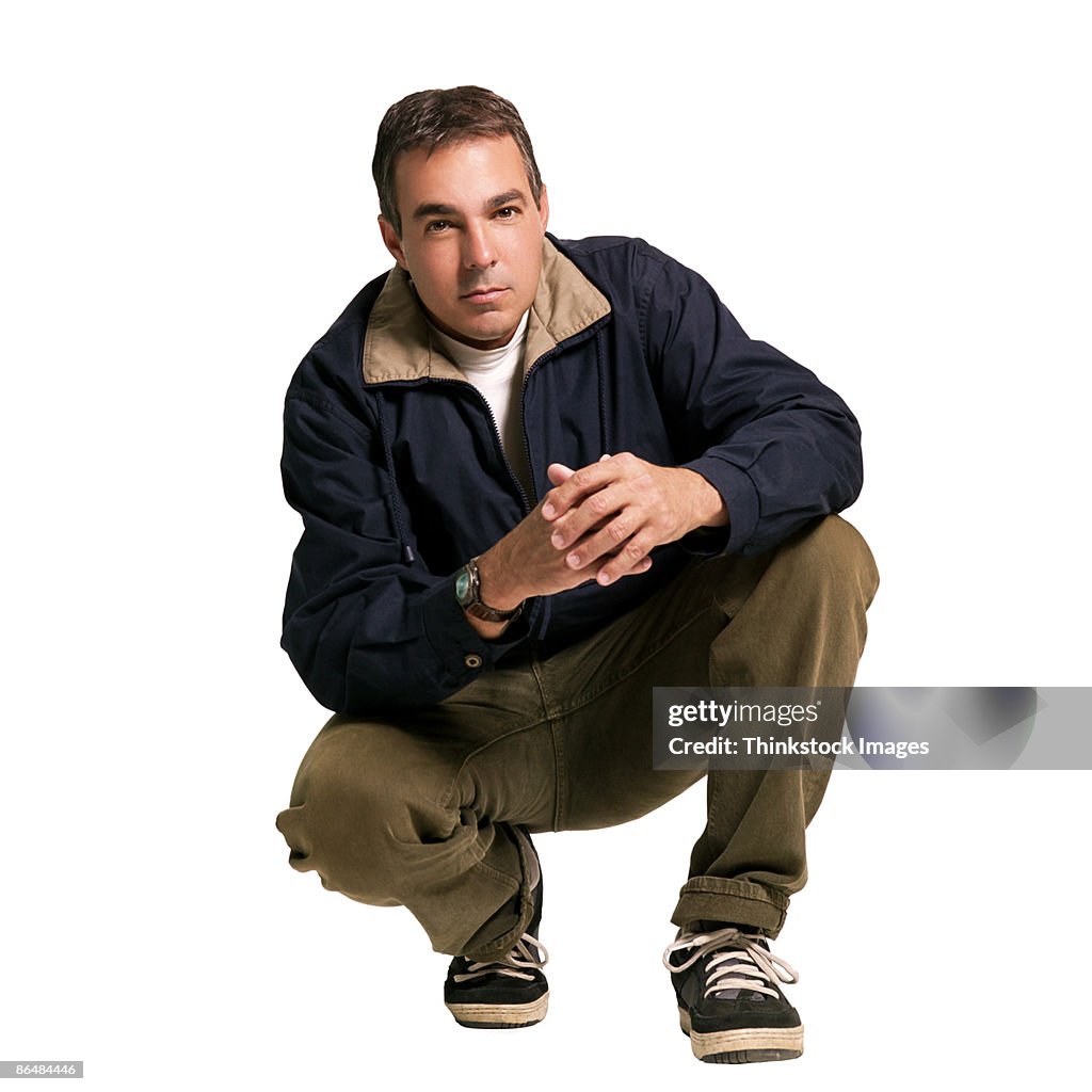 Portrait of man squatting