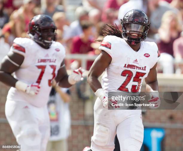 Louisville Cardinals running back Dae Williams smiles after scoring a touchdown during the game between the Louisville Cardinals and the Florida...