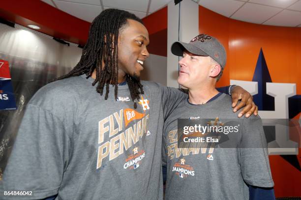 Cameron Maybin and Manager A.J. Hinch of the Houston Astros celebrate in the locker room after defeating the New York Yankees by a score of 4-0 to...