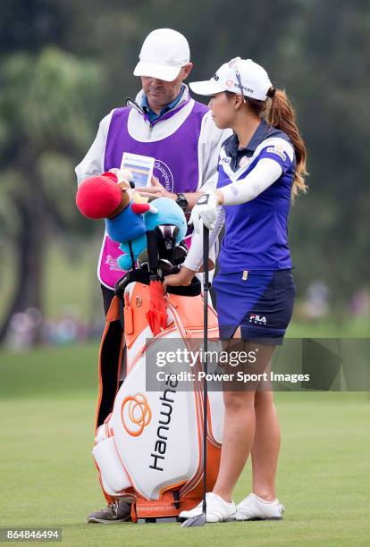 Jenny Shin of South Korea stands with her caddy on the second fairway during day four of Swinging Skirts LPGA Taiwan Championship on October 22, 2017...