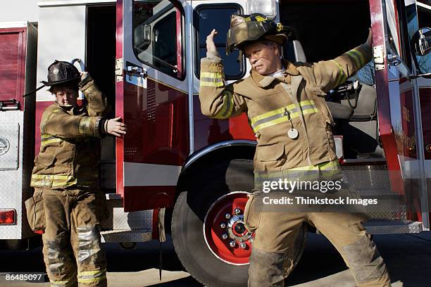 Getting Off A Fire Engine 2,799 Male And Female Firefighter Stock Photos, High-Res Pictures, and ...