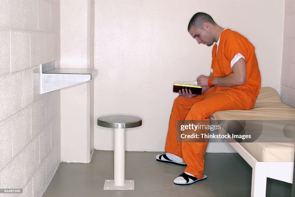 Inmate reading bible