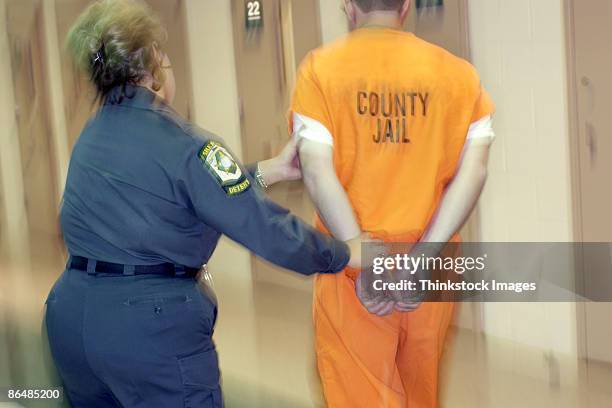 corrections officer with inmate - warders stock pictures, royalty-free photos & images