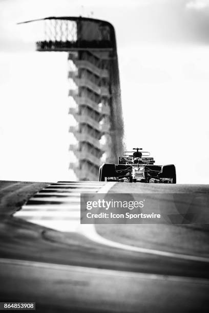 Ferrari driver Kimi Raikkonen of Finland drives through turn 10 with COTA tower in the background during qualifying for the Formula 1 United States...