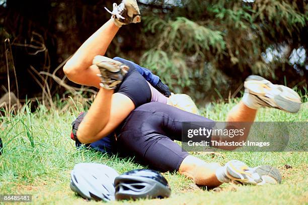 woman tackling man - rough housing stockfoto's en -beelden