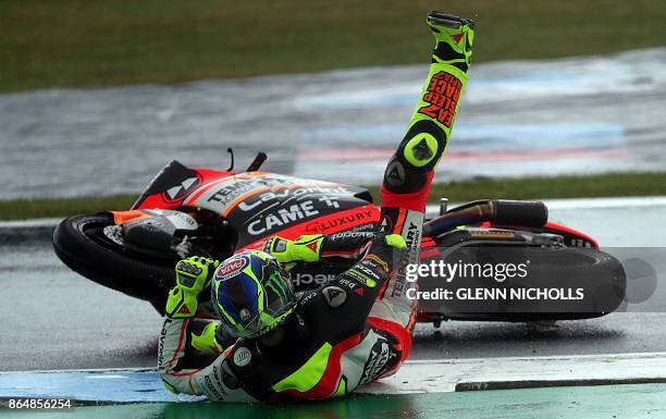 Kalex rider Lorenzo Baldassarri of Italy crashes during the warm up run ahead of the Moto2-class Grand Prix of the Australian MotoGP Grand Prix at...