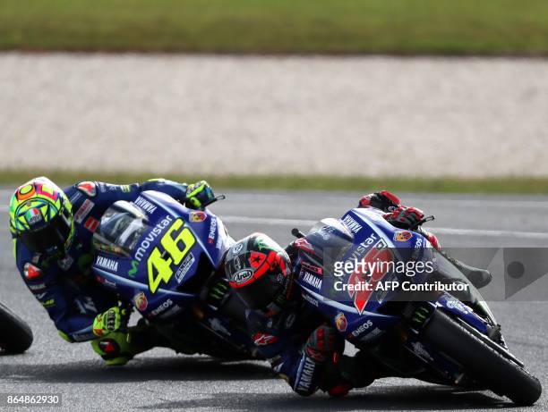 Yamaha rider Maverick Vinales of Spain and Yamaha rider Valentino Rossi of Italy negotiate a corner during the Australian MotoGP Grand Prix at...